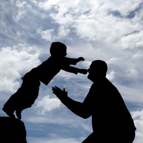 Kid jumping into adult's arms